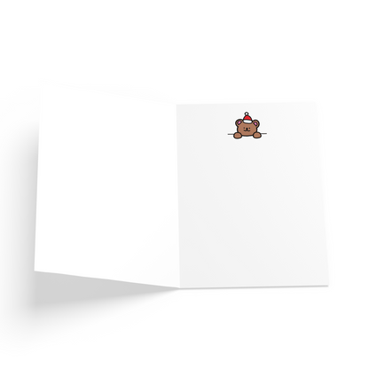 White card with a brown bear peeking on the inside.
